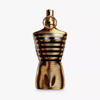 Gold perfume bottle with a white background