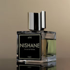 Nishane perfume bottle with a black label on a beige background
