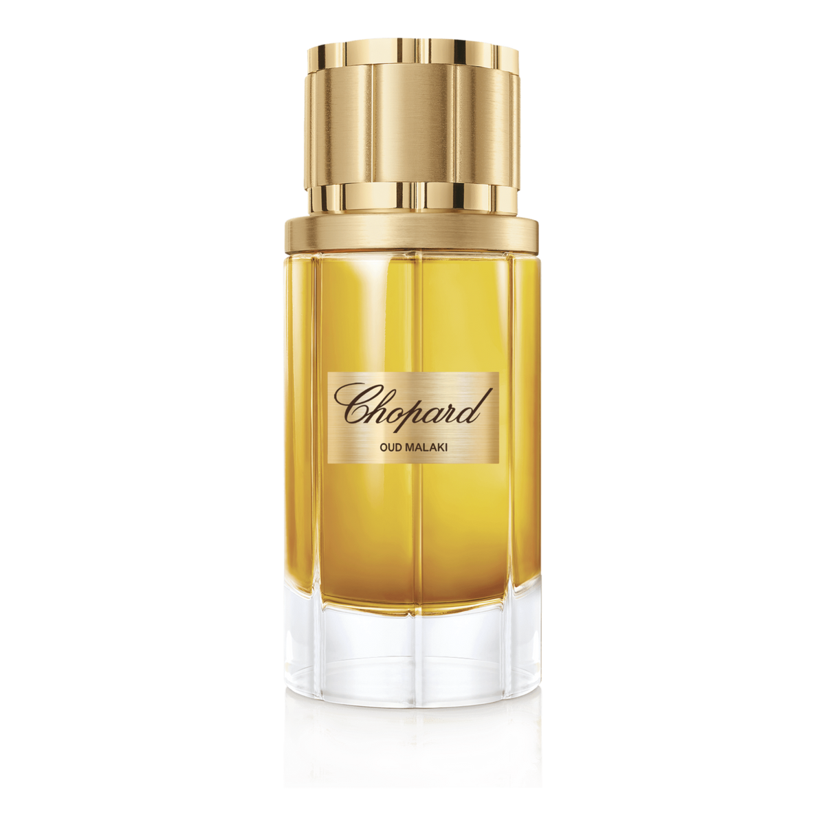 Chopard perfume bottle with gold cap on a green background