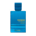 Blue perfume bottle labeled 'Haramain Amber Oud' on a white background