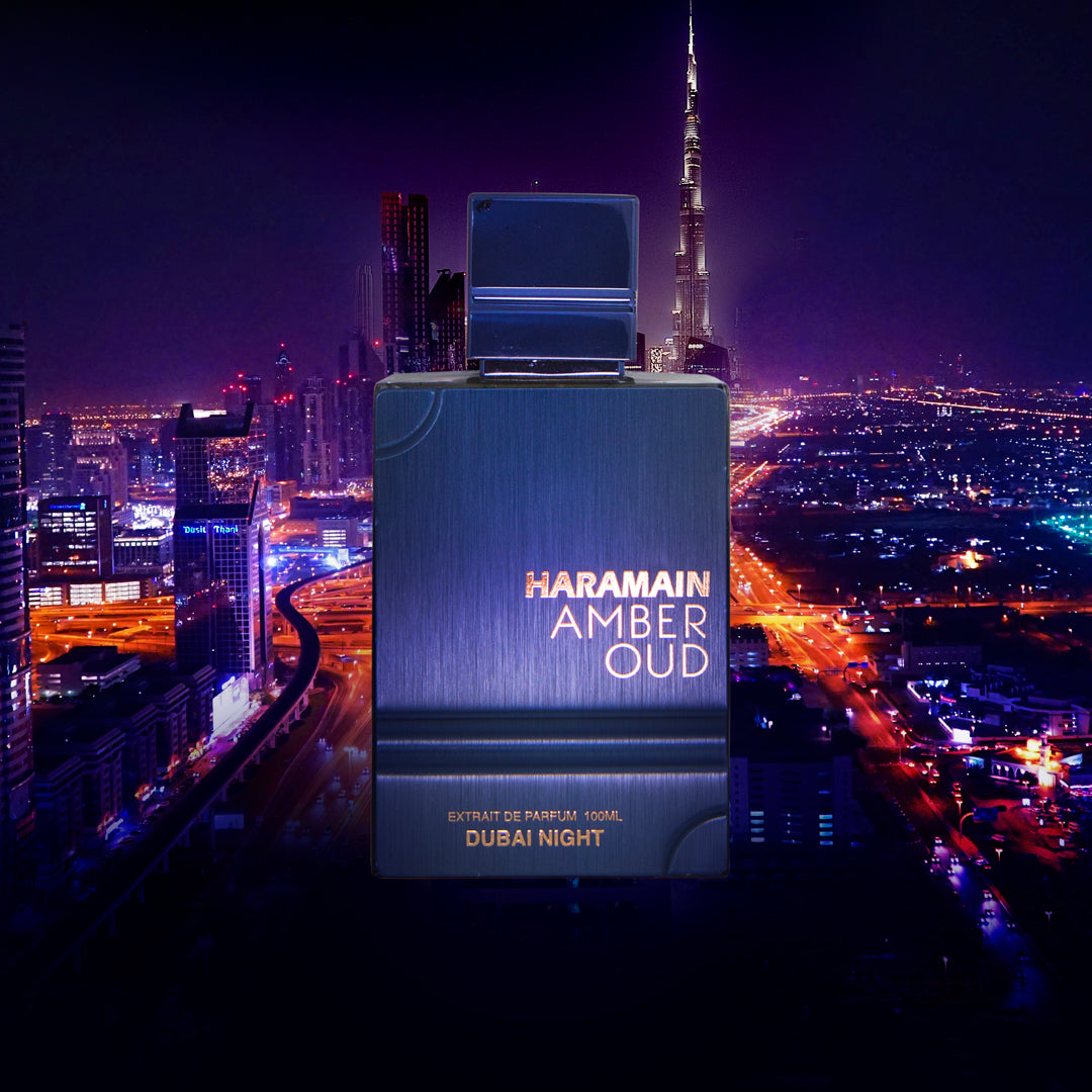 Haramain Amber Oud perfume bottle with Dubai skyline in the background