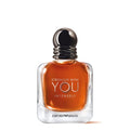 Perfume bottle with 'Stronger with You Intensely' text on a white background