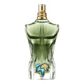 Green perfume bottle with decorative elements on a white background