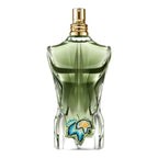 Green perfume bottle with decorative elements on a white background