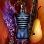 Blue striped perfume bottle Jean Paul Gaultier Ultra Male with lavender and a pear on an orange background