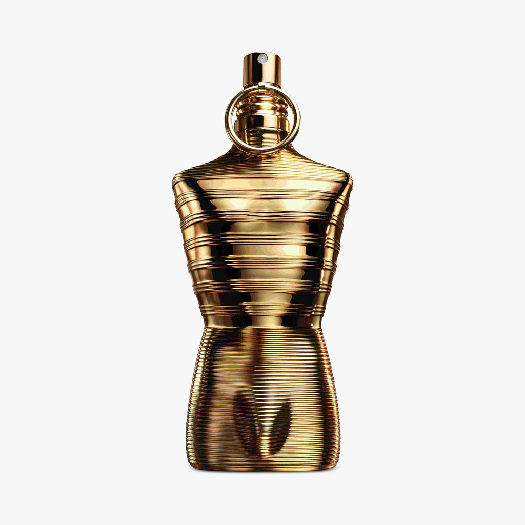 Gold perfume bottle Jean Paul Gaultier Le Male Elixir Absolu on a white background