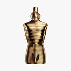 Gold perfume bottle Jean Paul Gaultier Le Male Elixir Absolu on a white background