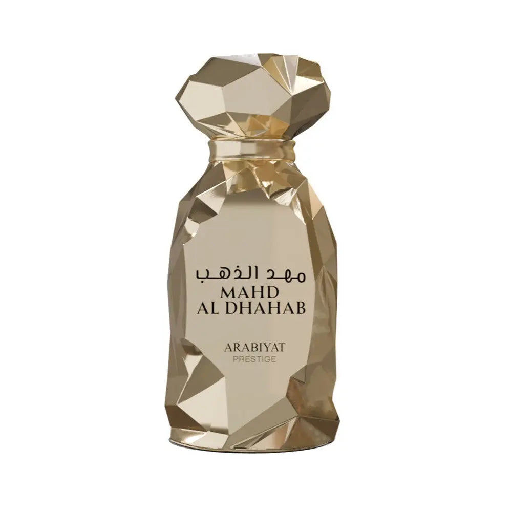 Mahd Al Dhahab Arabiyat Prestige Gold perfume bottle with geometric design on a white background