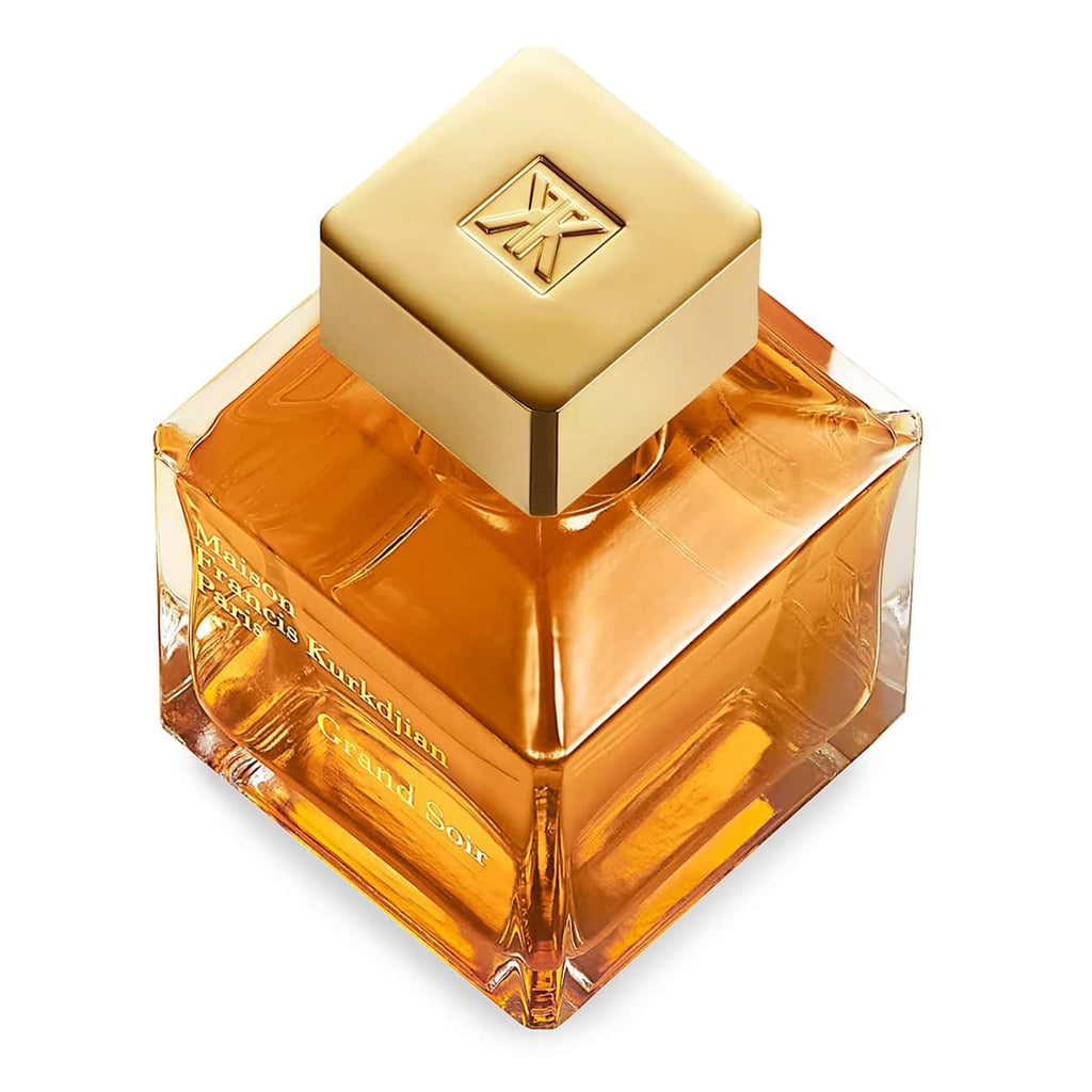 Perfume bottle with gold cap Maison Francis Kurkdjian Grand Soir on a white background